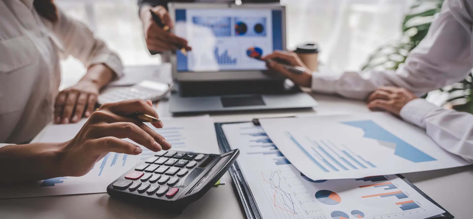 Business meeting with financial analysis documents
